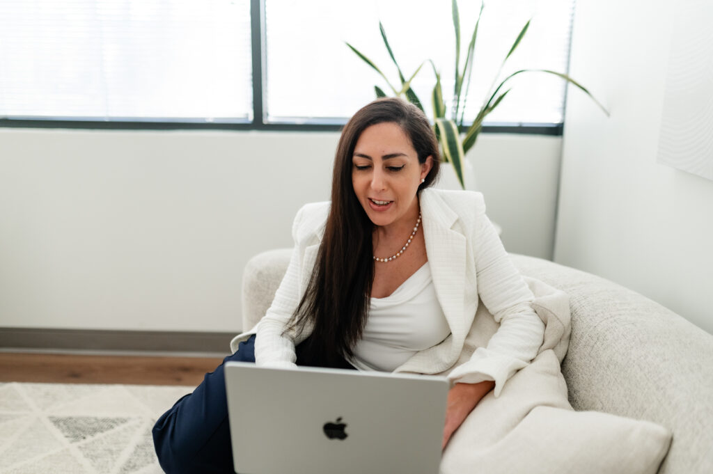 Woman typing on laptop computer